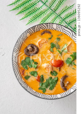 Creamy tom yum soup with shrimp coconut milk and herbs Creamy tom yum soup with shrimp coconut milk and herbs 136095292