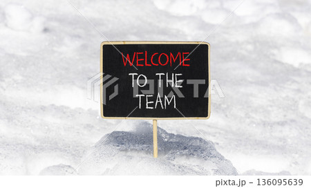 Support, help welcome to the team symbol. Concept words Welcome to the team on beautiful blackboard. Beautiful white snow background. Business welcome to the team concept. Copy space. Support, help welcome to the team symbol. Concept words Welcome to the team on beautiful blackboard. Beautiful white snow background. Business welcome to the team concept. Copy space. 136095639