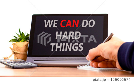 Support, help we can do hard things symbol. Concept words We can do hard things on beautiful tablet. Beautiful white background. Businessman's hand. Business we can do hard things concept. Copy space. 136095674