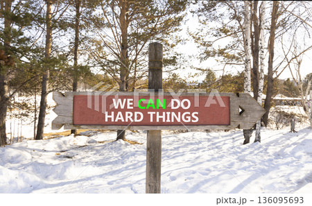 Support, help we can do hard things symbol. Concept words We can do hard things on beautiful wooden road sign. Beautiful winter forest background. Business we can do hard things concept. Copy space. Support, help we can do hard things symbol. Concept words We can do hard things on beautiful wooden road sign. Beautiful winter forest background. Business we can do hard things concept. Copy space. 136095693