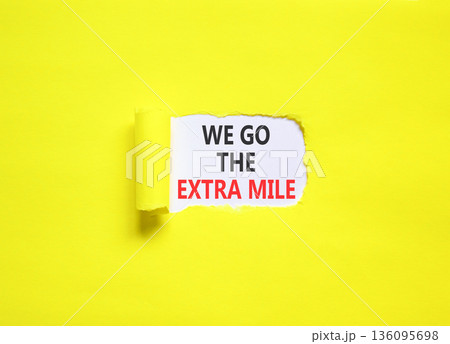 Support, help we go the extra mile symbol. Concept words We go the extra mile on beautiful white paper. Beautiful yellow paper background. Business we go the extra mile concept. Copy space. 136095698