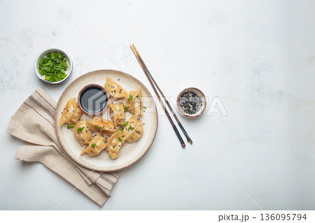 Gyoza dumplings soy sauce chopsticks asian Japanese food wontons copy space 136095794