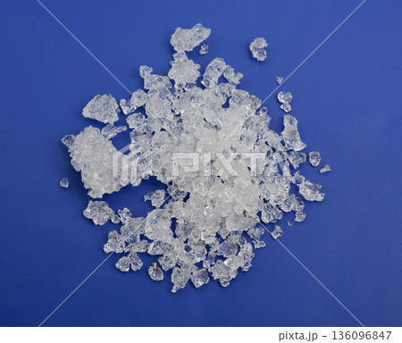 Cadmium nitrate powder on beige background 136096847