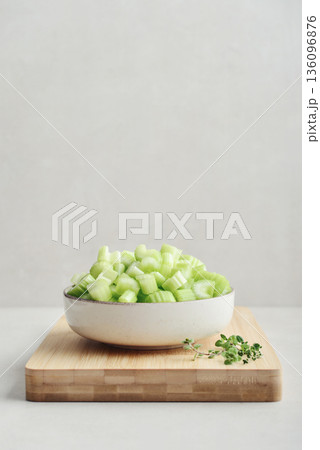 Chopped stalks of fresh celery in a bowl Chopped stalks of fresh celery in a bowl 136096876