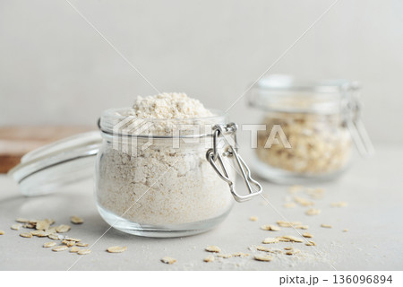 Oat flour in glass jar Oat flour in glass jar 136096894