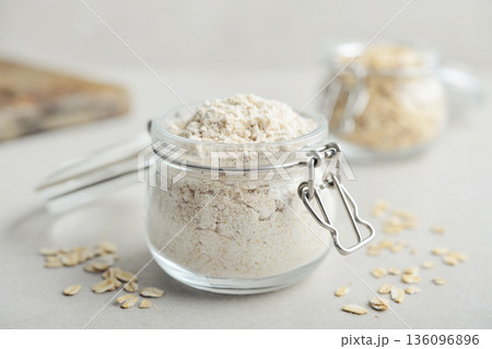 Oat flour in glass jar 136096896