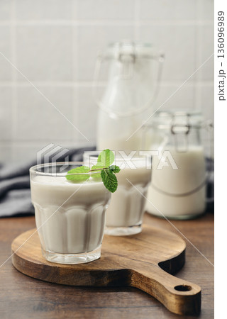 Two glasses of Turkish traditional drink ayran, kefir or buttermilk Two glasses of Turkish traditional drink ayran, kefir or buttermilk 136096989