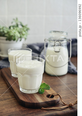 Two glasses of Turkish traditional drink ayran, kefir or buttermilk Two glasses of Turkish traditional drink ayran, kefir or buttermilk 136096992