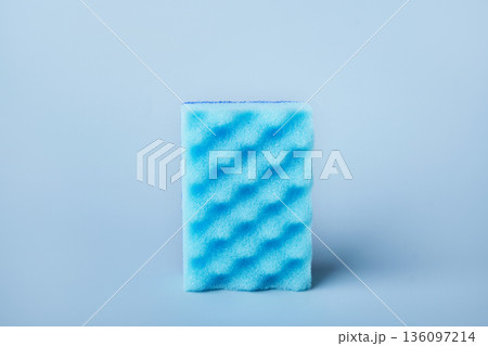 Blue dish sponge used for scrubbing and cleaning kitchen items 136097214