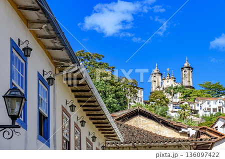 Facades of houses and churches Facades of houses and churches 136097422