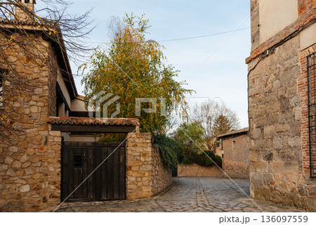 Medinaceli medieval village street with traditional stone house 136097559