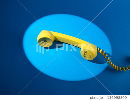 Retro vintage yellow rotary telephone 136098809