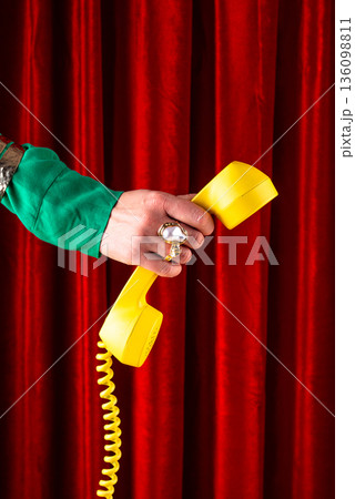 Female hand holding retro phone Female hand holding retro phone 136098811