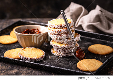 Alfajores, traditional Spanish sandwich cookies Alfajores, traditional Spanish sandwich cookies 136098880