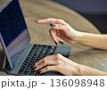 Woman hands working on tablet with wireless keyboard setup 136098948