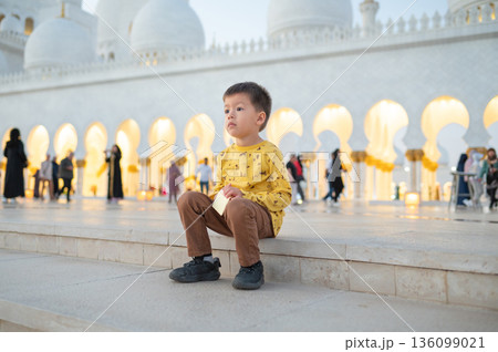 Young Boy Visiting Sheikh Zayed Grand Mosque in Abu Dhabi United Arab Emirates 136099021