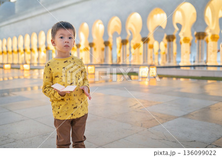 Young Boy Visiting Sheikh Zayed Grand Mosque in Abu Dhabi United Arab Emirates Young Boy Visiting Sheikh Zayed Grand Mosque in Abu Dhabi United Arab Emirates 136099022