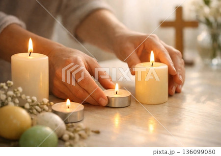 Hands Arranging Candles in Warm Light, Minimal Easter Reflection and Spiritual Calm Concept 136099080