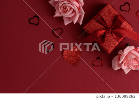 Festive Red Gift Boxes with Roses and Heart Confetti on Red Festive Background for Valentines Day Celebration Festive Red Gift Boxes with Roses and Heart Confetti on Red Festive Background for Valentines Day Celebration 136099862