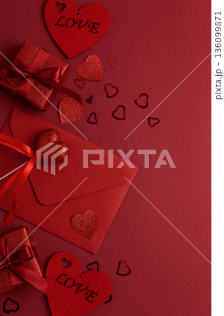 Romantic Envelope with Gifts and Roses on Festive Red Background for Valentines Day Celebration 136099871