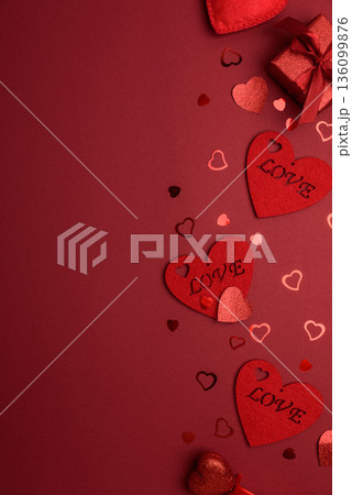 Valentines Day Flatlay with Red Hearts and Glitters on Festive Background 136099876