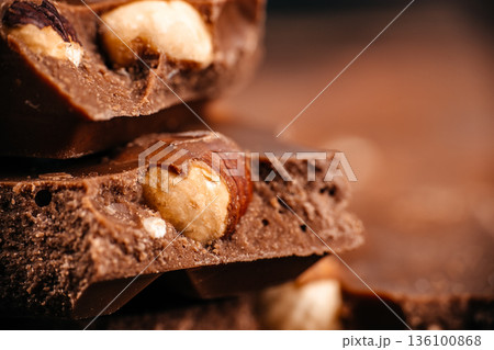 Milk chocolate with hazelnuts macro close up 136100868