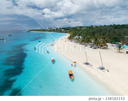 Boats, beautiful tropical beach with turquoise sea and white sand 136102153