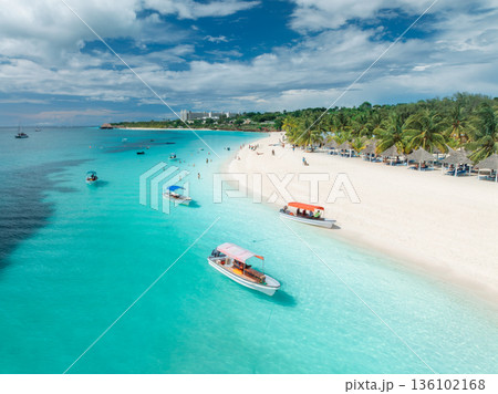Boats, beautiful tropical beach with turquoise sea and white sand 136102168