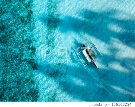 Aerial view of fishing boat, sea with clear turquoise water 136102254