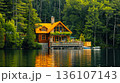 Serene lakeside cabin surrounded by lush forest with a cozy wooden design, reflecting on calm water, perfect for a peaceful retreat. 136107143
