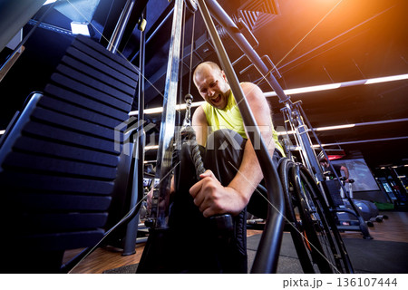 Disabled man training in the gym of rehabilitation center 136107444