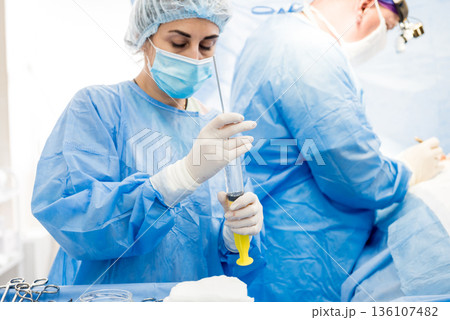 Surgery to remove the breast and replace it with an implant. 136107482