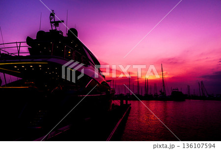 Beautiful view of marina and harbor with yachts and motorboats.  136107594