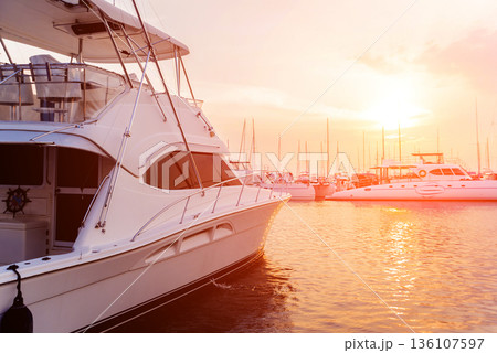 View of harbor with yachts details. Beautiful sunset sky in the marina bay. 136107597