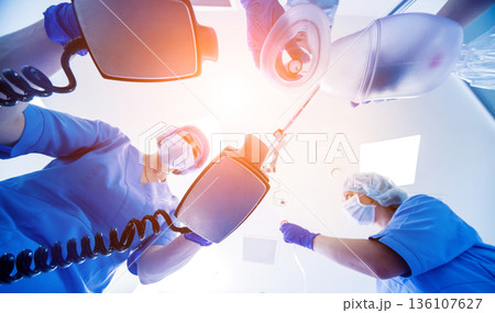 Doctors give resuscitation to a male patient in the emergency room. Doctors give resuscitation to a male patient in the emergency room. 136107627
