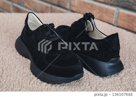 Elegant black leather womens shoes blank product for branding displayed. New casual female sneakers no-brand footwear e-commerce. No logo product Elegant black leather womens shoes blank product for branding displayed. New casual female sneakers no-brand footwear e-commerce. No logo product 136107688