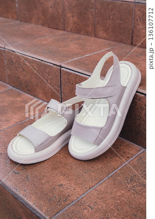 Elegant beige leather women sandals blank product for summer fashion branding and premium product showcases. Modern casual design and soft leather texture retail, e-commerce catalogs. No-brand Elegant beige leather women sandals blank product for summer fashion branding and premium product showcases. Modern casual design and soft leather texture retail, e-commerce catalogs. No-brand 136107712