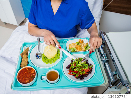 Tray with breakfast for the young female patient. Tray with breakfast for the young female patient. 136107784