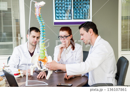 Doctors team having medical council in hospital.  136107861