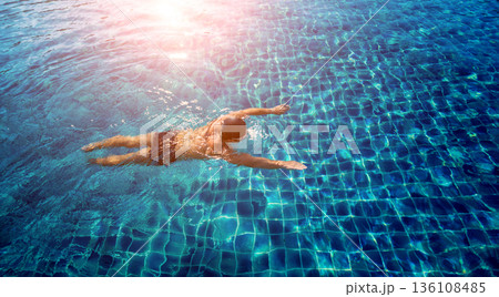 Young athletic man swimming in the swimming pool Young athletic man swimming in the swimming pool 136108485