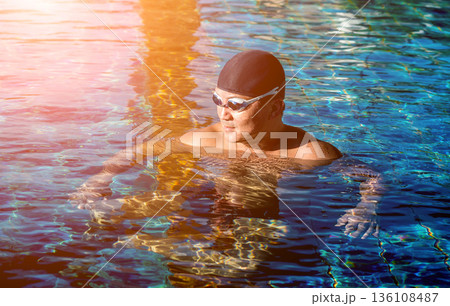 Young athletic man swimming in the swimming pool Young athletic man swimming in the swimming pool 136108487