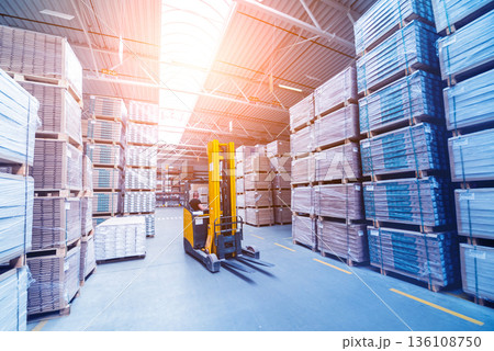 Forklift loader in storage warehouse ship yard. Distribution products. Forklift loader in storage warehouse ship yard. Distribution products. 136108750