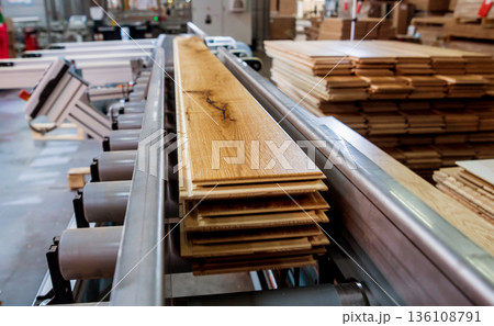 Production line of the wooden floor factory. CNC automatic woodworking machine. 136108791