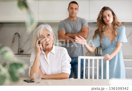 Young couple quarrel their grandmother Young couple quarrel their grandmother 136109342