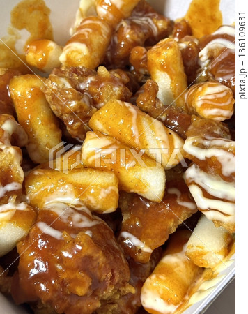 Crispy Korean fried chicken, perfectly glazed with a sweet and spicy sauce. Ideal for food photography and menus, showcasing the irresistible crunch and flavor of this beloved dish. 136109631