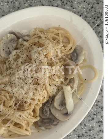 Creamy and rich spaghetti coated in a luscious white sauce, offering a smooth and savory flavor perfect for a comforting and satisfying meal. Creamy and rich spaghetti coated in a luscious white sauce, offering a smooth and savory flavor perfect for a comforting and satisfying meal. 136109633