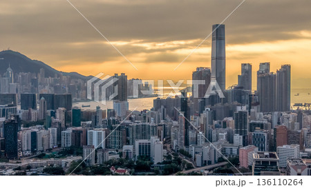 Warm Sunset Illuminates Yau Tsim Mong Skyline And Harbour 136110264
