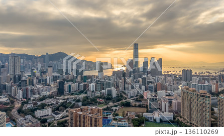 Warm Sunset Illuminates Yau Tsim Mong Skyline And Harbour 136110269