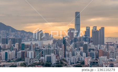Warm Sunset Illuminates Yau Tsim Mong Skyline And Harbour 136110279