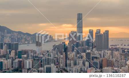 Warm Sunset Illuminates Yau Tsim Mong Skyline And Harbour 136110287